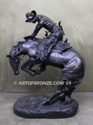 Rattlesnake bronze statue cowboy on bucking horse after Frederic Remington