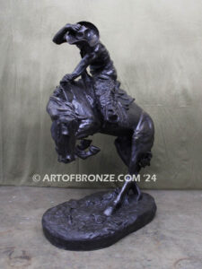 Rattlesnake bronze statue cowboy on bucking horse after Frederic Remington