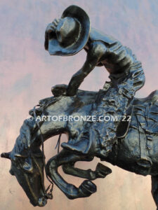 Rattlesnake bronze statue cowboy on bucking horse after Frederic Remington