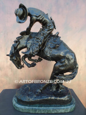 Rattlesnake bronze statue cowboy on bucking horse after Frederic Remington