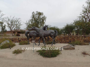 Romance bronze sculpture of standing mare and running colt horse for Griffin Ranch in La Quinta, CA