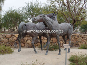 Romance bronze sculpture of standing mare and running colt horse for Griffin Ranch in La Quinta, CA