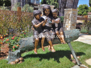 Special Touch bronze sculpture of three kids sitting on log with a injured baby bird in their hands