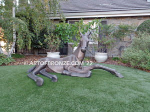 Spring Blessing bronze sculpture of resting foal, filly, colt and yearling horse for ranch or equestrian center