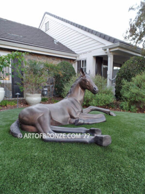 Spring Blessing bronze sculpture of resting foal, filly, colt and yearling horse for ranch or equestrian center