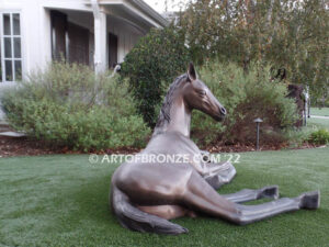 Spring Blessing bronze sculpture of resting foal, filly, colt and yearling horse for ranch or equestrian center