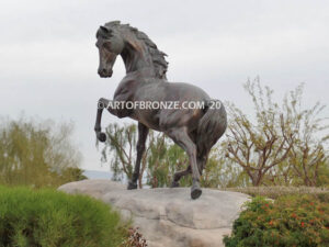 Striking Freedom bronze monument statue of assertive stallion horse for Griffin Ranch in La Quinta, CA