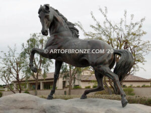 Striking Freedom bronze monument statue of assertive stallion horse for Griffin Ranch in La Quinta, CA