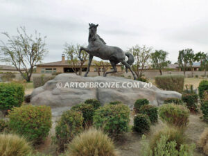 Striking Freedom bronze monument statue of assertive stallion horse for Griffin Ranch in La Quinta, CA