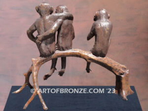 Threes a crowd whimsical bronze statue of three monkeys sitting on bronze bench