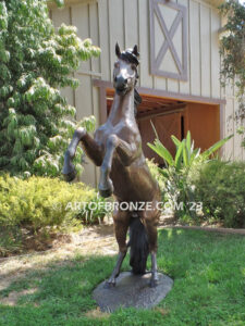 Thunderstorm sculpture of reared horse with forelegs off the ground and hind legs attached bronze base