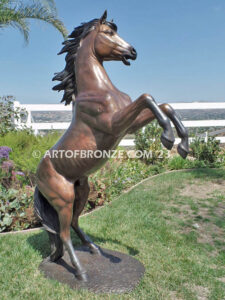 Thunderstorm sculpture of reared horse with forelegs off the ground and hind legs attached bronze base