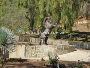 Wild Country sculpture of reared horse with forelegs off the ground and hind legs attached bronze base