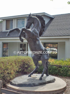 Wild Country sculpture of reared horse with forelegs off the ground and hind legs attached bronze base