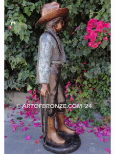 Wild West Spirit bronze statue standing cowgirl holding rope dressed in western attire
