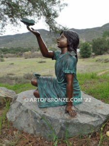 Wings of Joy bronze sculpture of sitting girl in dress with bronzes butterflies