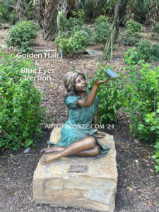 Wings of Joy bronze sculpture of sitting girl in dress with bronzes butterflies