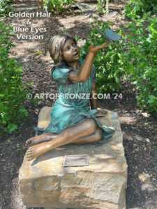 Wings of Joy bronze sculpture of sitting girl in dress with bronzes butterflies