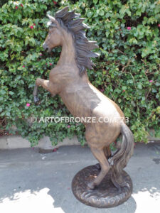 Thunderstorm statue of reared horse with forelegs off the ground and hind legs attached bronze base