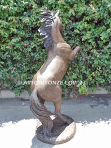 Thunderstorm statue of reared horse with forelegs off the ground and hind legs attached bronze base