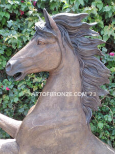 Thunderstorm statue of reared horse with forelegs off the ground and hind legs attached bronze base