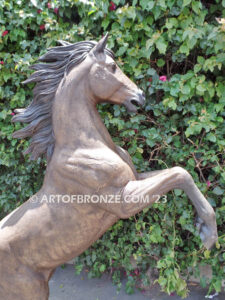 Thunderstorm statue of reared horse with forelegs off the ground and hind legs attached bronze base