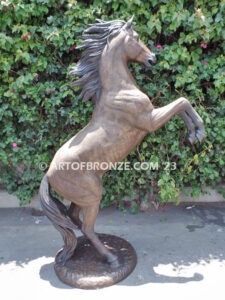 Thunderstorm statue of reared horse with forelegs off the ground and hind legs attached bronze base