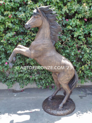 Thunderstorm statue of reared horse with forelegs off the ground and hind legs attached bronze base