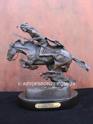 The Cheyenne bronze sculpture after Frederic Remington featuring warrior on galloping horse