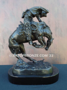 Rattlesnake bronze statue cowboy on bucking horse after Frederic Remington