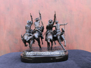 Coming Thru the Rye bronze sculpture after Frederic Remington featuring four horseman on galloping horses
