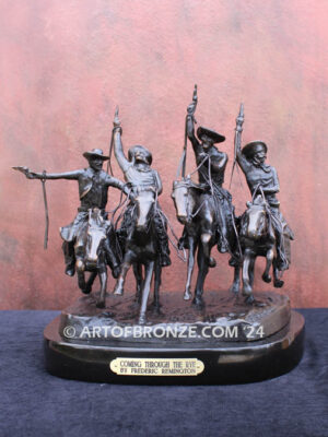 Coming Thru the Rye bronze sculpture after Frederic Remington featuring four horseman on galloping horses