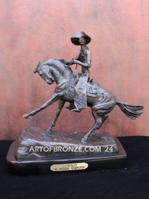 The Cowboy bronze sculpture after Frederic Remington featuring cowboy on horse