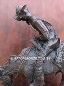 The Norther bronze statue after Frederic Remington featuring cowboy caught in forceful winds atop his horse