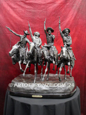 Coming Thru the Rye bronze statue after Frederic Remington featuring four horseman on galloping horses