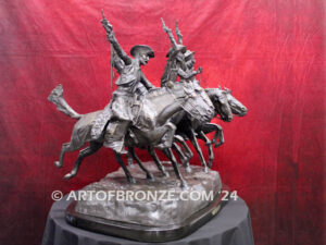 Coming Thru the Rye bronze statue after Frederic Remington featuring four horseman on galloping horses