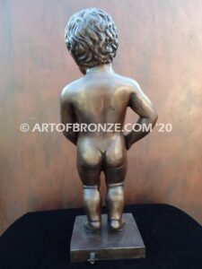 Manneken Pis 17th century bronze sculpture of naked little boy peeing into fountain