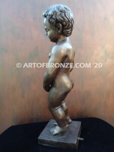 Manneken Pis 17th century bronze sculpture of naked little boy peeing into fountain