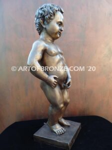 Manneken Pis 17th century bronze sculpture of naked little boy peeing into fountain