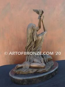 Spirit of the Sky bronze statue of seated Native American Indian woman holding bird