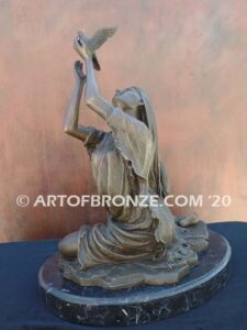 Spirit of the Sky bronze statue of seated Native American Indian woman holding bird