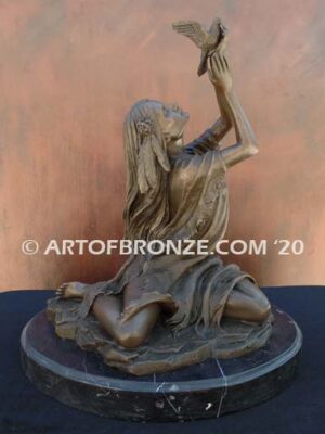 Spirit of the Sky bronze statue of seated Native American Indian woman holding bird