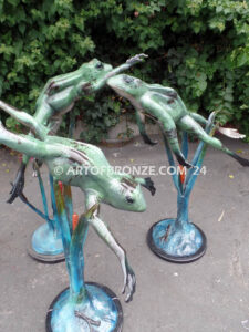 Swimming Lessons bronze sculptures of playful and whimsical frogs for outdoor and garden display