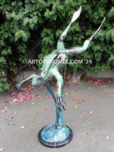 Swimming Lessons bronze sculptures of playful and whimsical frogs for outdoor and garden display