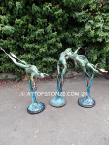 Swimming Lessons bronze sculptures of playful and whimsical frogs for outdoor and garden display