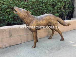 Echoes in the Night life-size standing coyote howling at the moon bronze sculpture