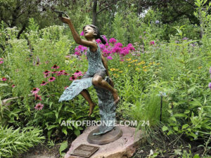 McCrory Garden outdoor bronze statue butterfly girl sitting on leaf