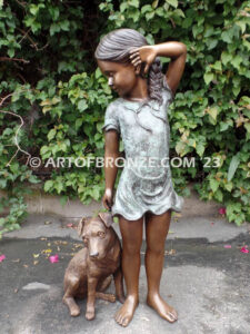 Girls Best Friend bronze sculpture of girl playing with puppy