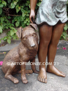 Girls Best Friend bronze sculpture of girl playing with puppy