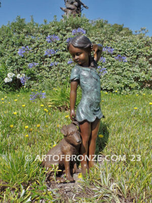 Girls Best Friend bronze sculpture of girl playing with puppy